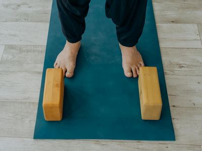Yoga block and water bottle on a mat
